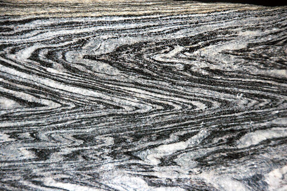 Chevron folds in gneiss — press to examine